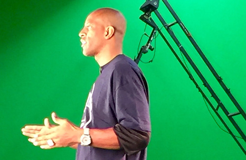 Jerome Williams in front of a green screen.