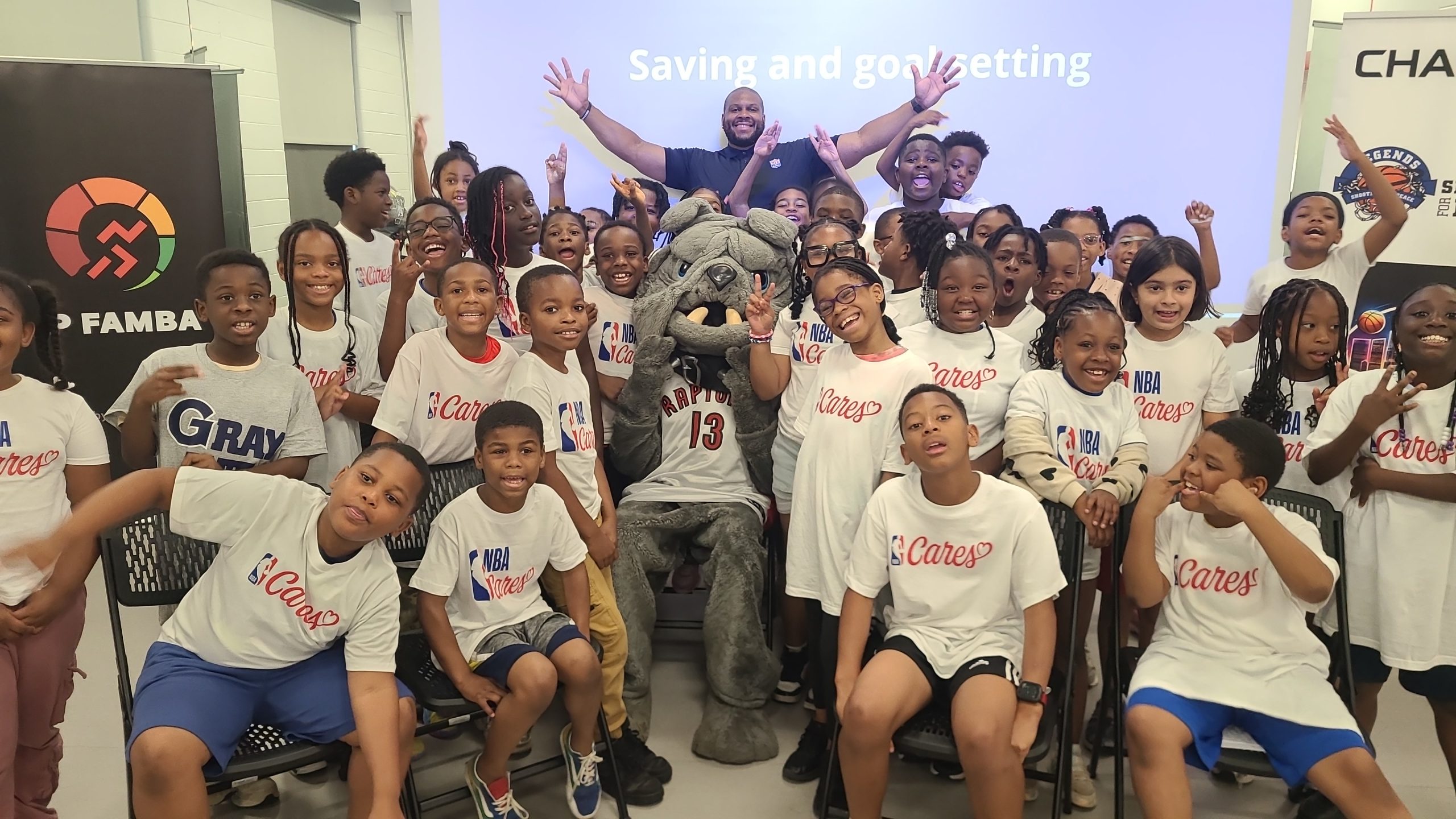 Jerome Junkyard Dog Williams coaching kids during the Shooting for Peace basketball clinic at Middle Fitness & Wellness Center in Baltimore, Maryland, June 2025